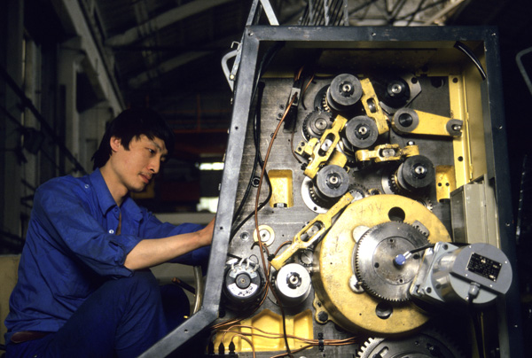 Worker assembles printer