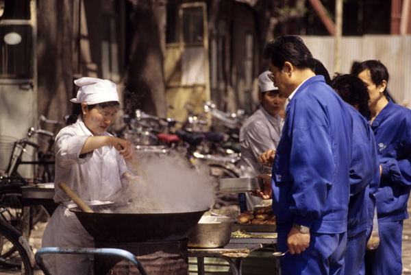 Workers line up for lunch