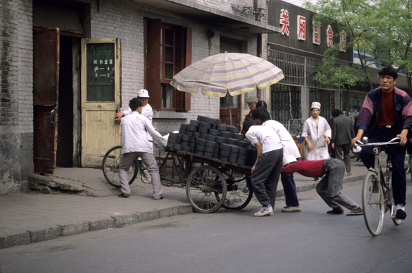 Workers hauling coal