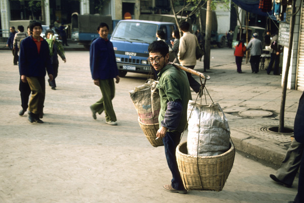 Man with shoulder pole