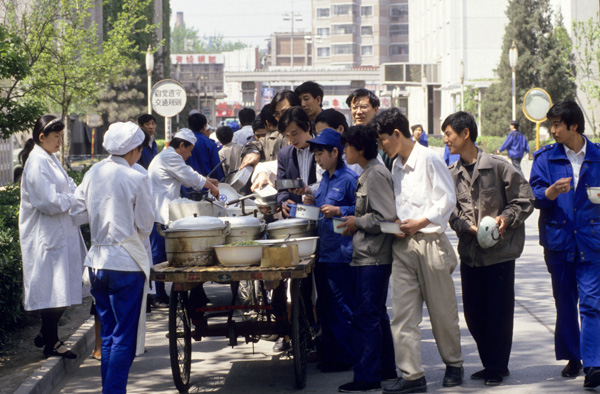 Workers line up for lunch