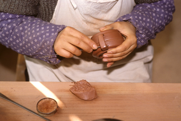 Potter makes Yixing teapot