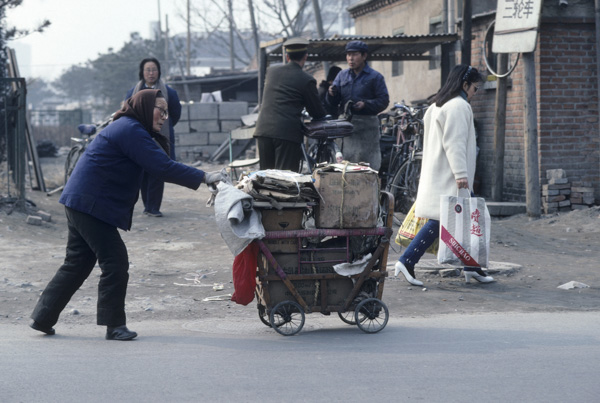 Two women with bags, Beijing, China.