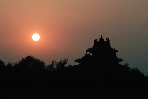 Corner tower and sunset at the Forbidden City, China