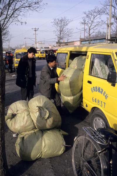 Buyer loads up clothing at wholesale makret