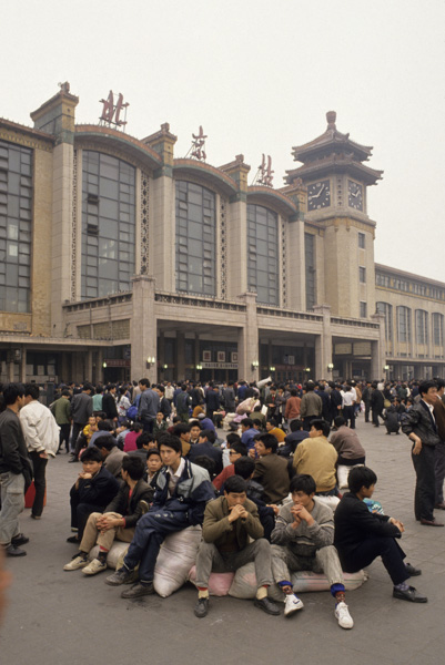 People wait at train station