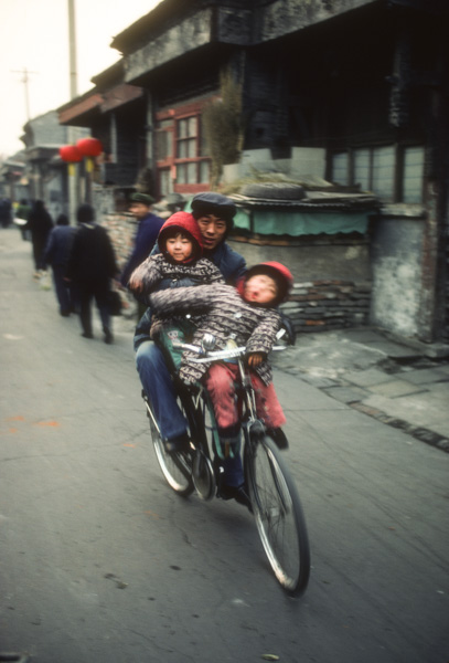 Man and children on bicycle at Liulichang