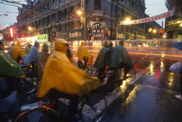 Rain and bicyclists in Shanghai