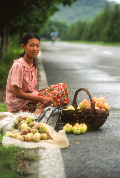 Girl selling peaches