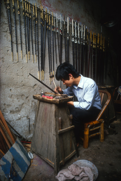 Artisan making scales