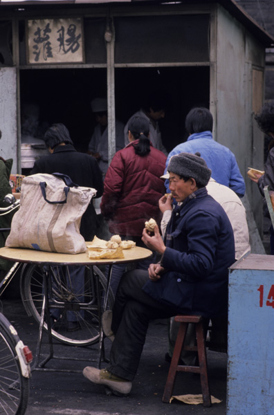 Customer eating steamed dumplings