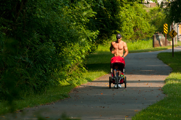 Jogger Dad with Stroller on Nature Trail