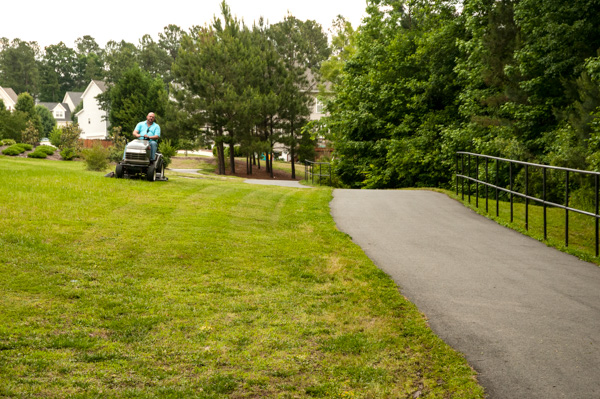 Property owner mows next to nature trail, Apex, North Carolina