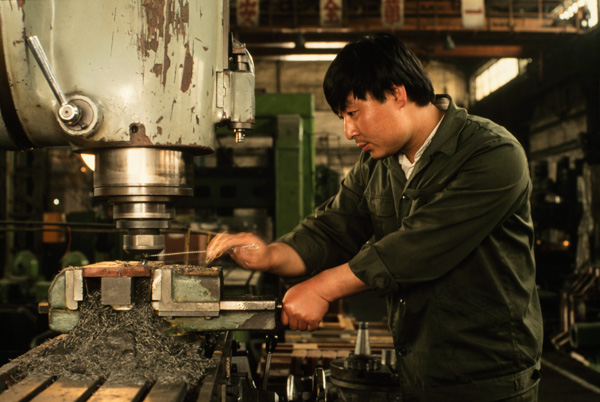 Worker in factory, Beijing