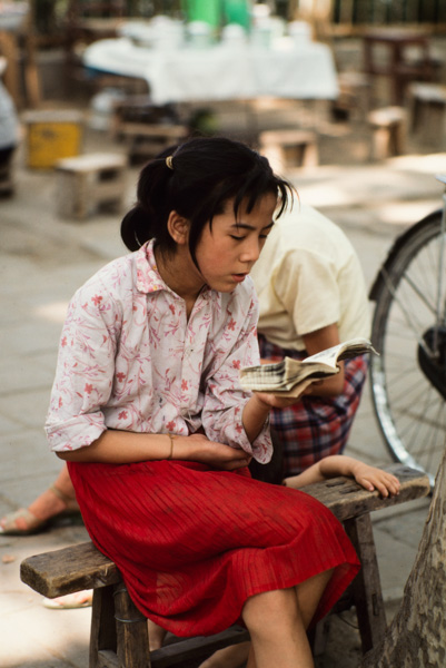 Girl reading, China.