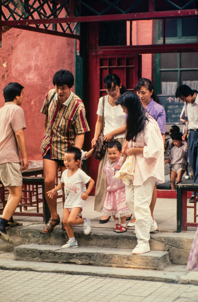 Children and parents leave Beijing kindergarten