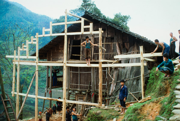 Timber house under construction, Peace Village, China