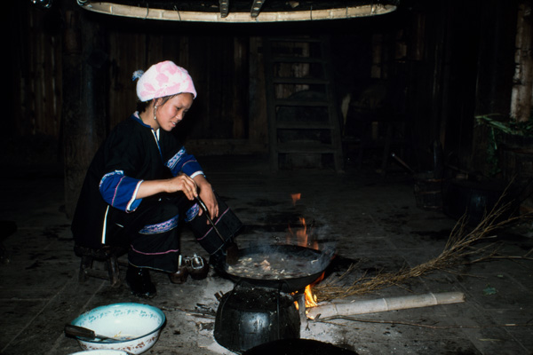 Woman cooking, Peace Village