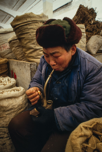 Man smokes pipe