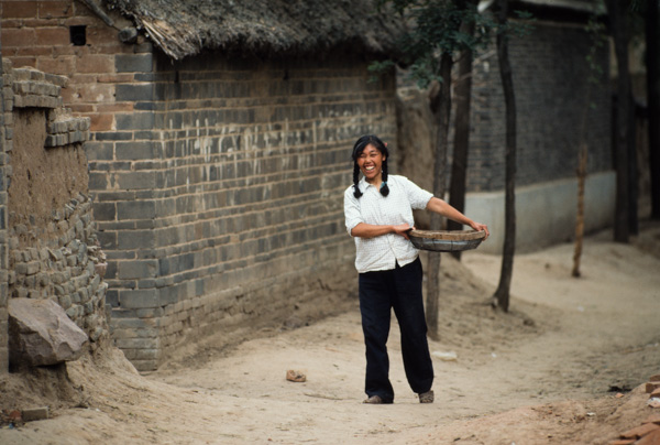 Woman in village, China