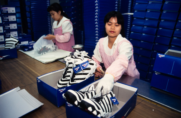 Chinese workers box Reebok shoes