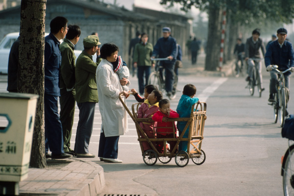 Woman caring for five children, Beijing