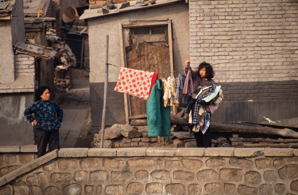 Woman and laundry in courtyard, Beijing