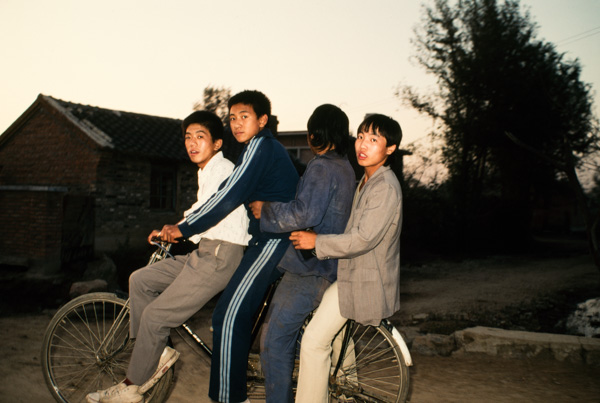 Four boys on bicycle