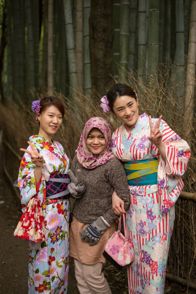 Tourists in kimono with Muslim woman, Bamboo Forest, Kyoto