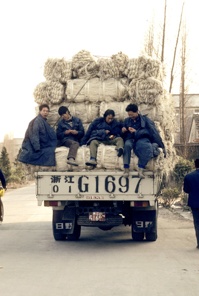 Men ride on truck