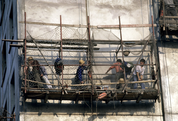 Construction workers on scaffolding