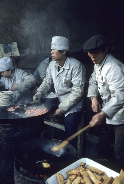 Cooks in street restaurant