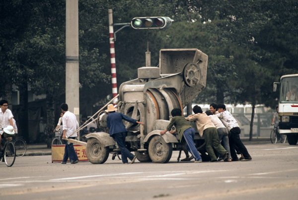 Pushing cement mixer